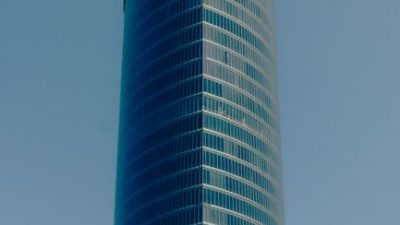 Stunning view of the Iberdrola Tower in Bilbao with a clear blue sky backdrop.